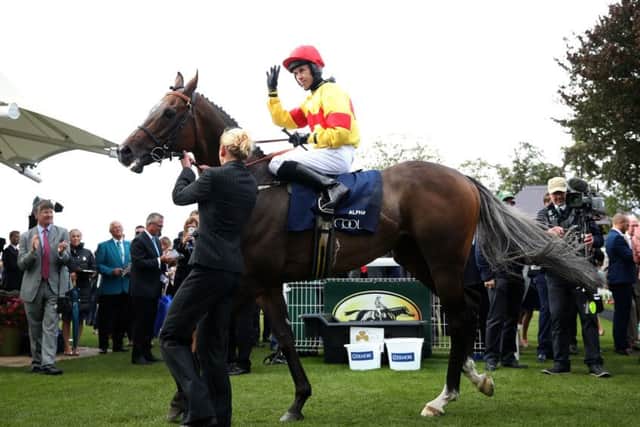 Alpha Delphini and Graham Lee return to the winner's enclosure after winning the Nunthorpe Stakes at the Ebor festival.