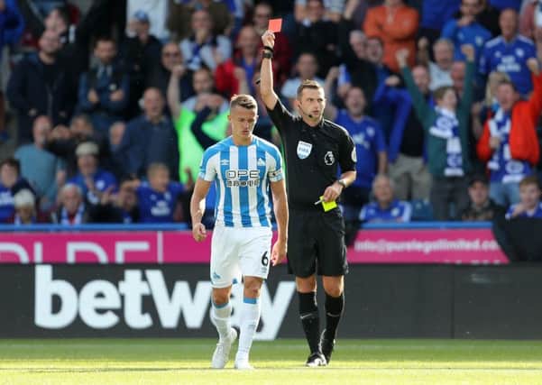 Off: Huddersfield Town's Jonathan Hogg receives his red card from referee Michael Oliver.