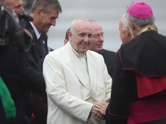 Pope Francis is greeted by a delegation of clergy and representatives from Ireland West Airport as he arrives at the airport in Knock in County Mayo, as part of his visit to Ireland.  PIC: Yui Mok/PA Wire