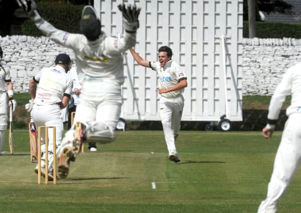 Got him:  New Farnley wicketkeeper Steve Bullen catches Pudsey St Lawrence's Charlie Best off Andrew Brewster.