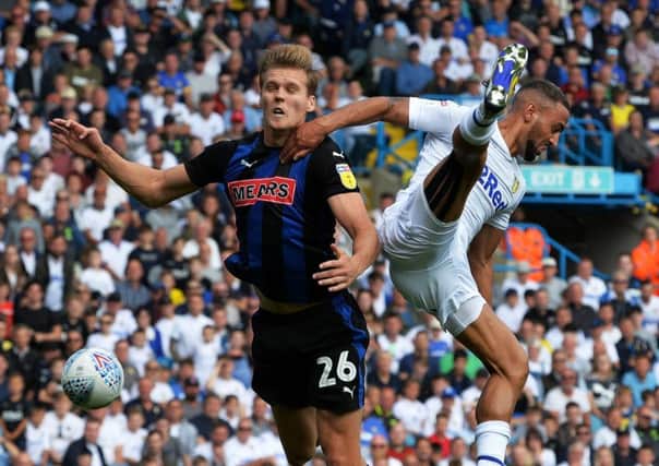 Sean Raggett, pictured playing against Leeds United's Kemar Roofe earlier this season, scored the only goal of the game against Millwall. (Picture: Bruce Rollinson)