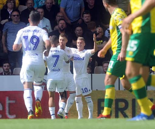 Ezgjan Alioski, No 10, is congratutated after scoring the second of Leeds Uniteds three goals at Norwich City (Picture: Simon Hulme).