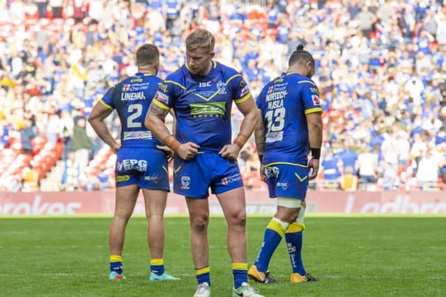 AGONY: Warrington Wolves' Tom Lineham, Mike Cooper and Ben Murdoch-Masila after the Challenge Cup Final loss to Catalans Dragons. Picture by Allan McKenzie/SWpix.com