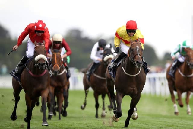CLOSE CALL: Alpha Delphini, ridden by Graham Lee, right, beat Mabs Cross in a photo-finish to win the Nunthorpe Stakes. Picture: Tim Goode/PA