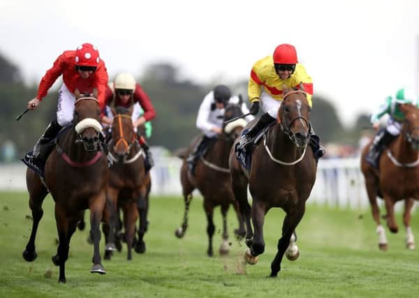 CLOSE CALL: Alpha Delphini, ridden by Graham Lee, right, beat Mabs Cross in a photo-finish to win the Nunthorpe Stakes. Picture: Tim Goode/PA