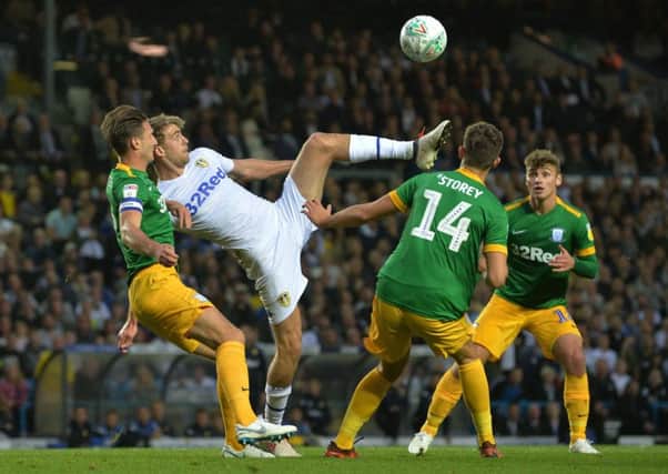 Leeds Uniteds Patrick Bamford attempts to get a high ball undercontrol with three Preston North End players in close attendance (Picture: Bruce Rollinson).