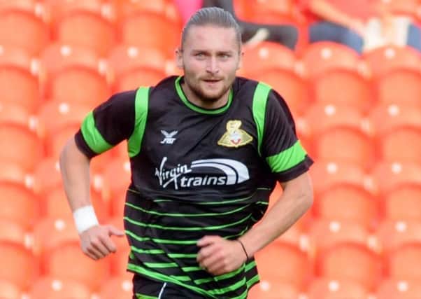 Alfie May scored for Doncaster Rovers as they fell to defeat against Blackpool.