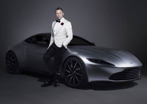 Aston Martin has long been the choice of car for James Bond. Pic: PA Wire/MGM