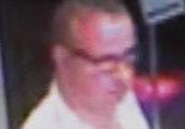 A CCTV image of the man who went to the aid of the victim.