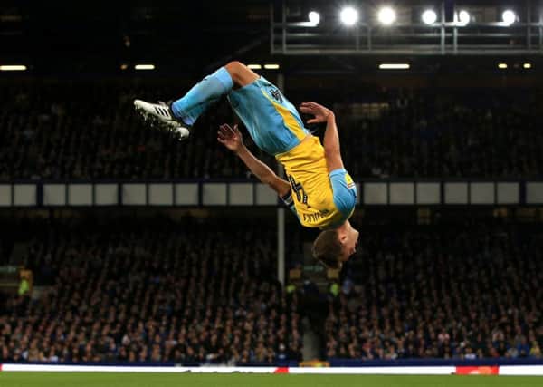 Rotherham United's Will Vaulks celebrates scoring his side's first goal of the Carabao Cup, second round match at Goodison Park with a dramatic somersault. (Pictures: Peter Byrne/PA)