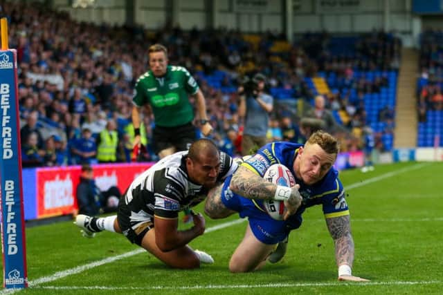 ANOTHER ONE: Warrington's Josh Charnley scores a try. Picture: Alex Whitehead/SWpix.com