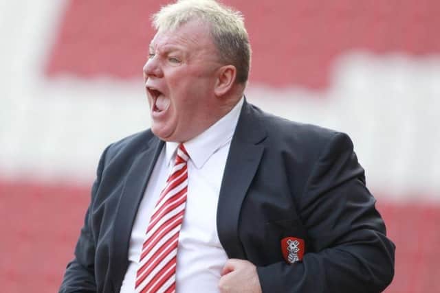 Former Rotherham boss Steve Evans has taken Peterborough to the top of League One.