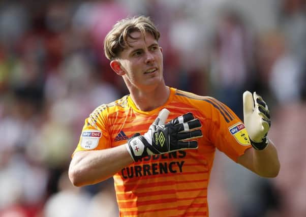 Perfect fit: Manchester United goalkeeper Dean Henderson is hoping to help Sheffield United make it four wins on the spin. (Picture: SportImage)