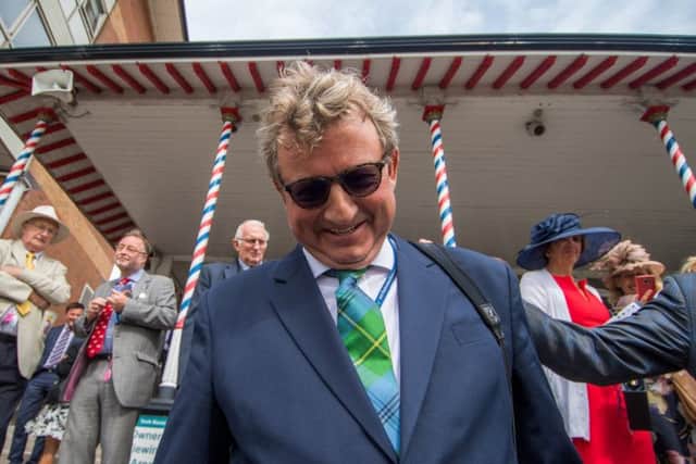 Middleham trainer Mark Johnson, celebrates after breaking the the all-time record for the number of British winners for a racehorse trainer at the Ebor Festival.