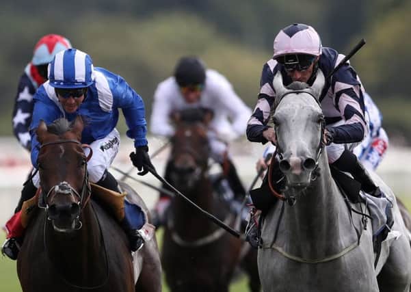 Lord Glitters ridden by Daniel Tudhope, right, wins the Sky Bet And Symphony Group Strensall Stakes at the Ebor Festival.