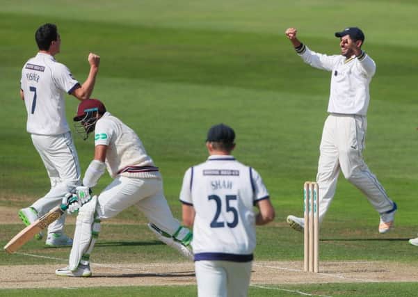 Yorkshire's Matthew Fisher celebrates with Jack Leaning and Adam Lyth after taking the wicket of Somerset's Azhar Ali. Picture: Alex Whitehead/SWpix.com