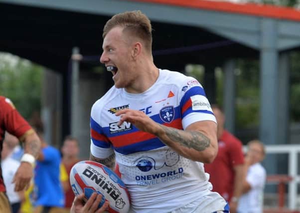 Tom Johnstone shone opposite fellow winger Jermaine McGillvary and scored two tries and made another as Wakefield Trinity beat Huddersfield Giants 42-16 (Picture: Bruce Rollinson).