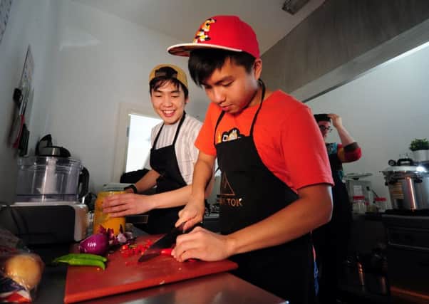 William Chew and Shang Yin NG at work in the kitchen.