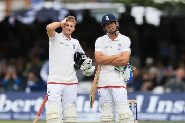 Alastair Cook, right, takes a break during a partnership with Yorkshire's Joe Root, the man who succeeded him as Test captain. Picture: PA.