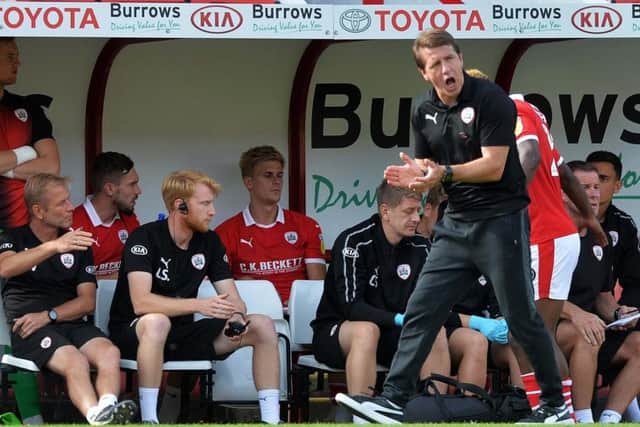 Reds Head Coach Daniel Stendel, right, urges his team on, with assistant Andreas Winkler, far left, watching on. Picture: Steve Ellis.