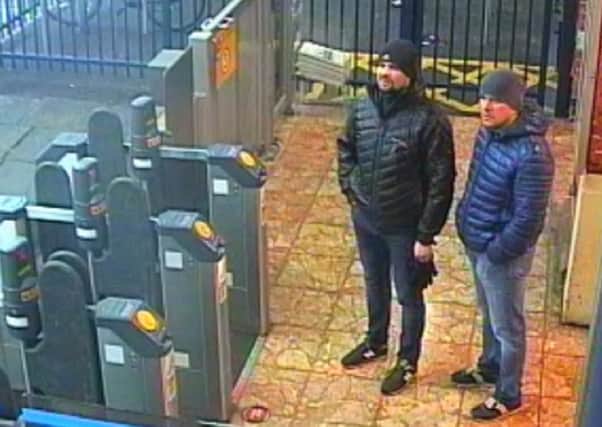 and Handout CCTV image issued by the Metropolitan Police of Russian Nationals Ruslan Boshirov and Alexander Petrov at Salisbury train station at 16:11hrs on March 3 2018.