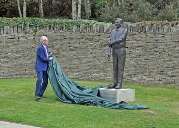 RETAIL ICON: Tony King, who has worked for Morrisons for 42 years, unveils a statue of the companys founder Sir Ken Morrison at its Bradford HQ. PIC: Tony Johnson