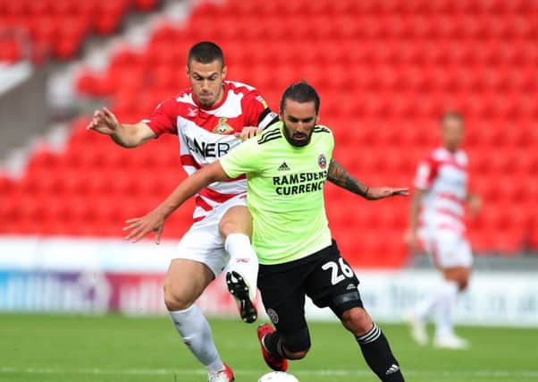 Doncaster Rovers' Tommy Rowe battles for possession during a pre-season friendly against Sheffield United. Picture: Simon Bellis/Sportimage