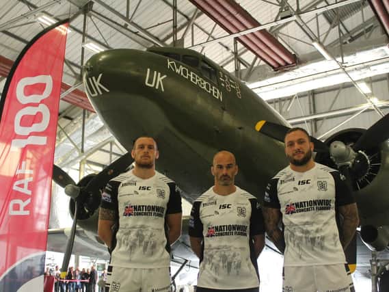 Hull FC players Dean Hadley, Danny Houghton and Josh Griffin (L-R) at RAF Coningsby earlier this week, stood next to a Dakota aircraft which forms part of the Battle of Britain Memorial Flight. Hull FC will pay tribute to the RAF in their official Armed Forces Day fixture against Castleford Tigers tonight when they will wear this special-edition shirt. (PIC: Hull FC)