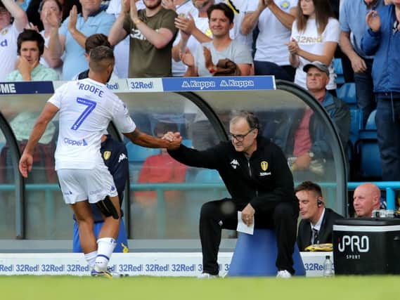 Leeds United's Kemar Roofe and Leeds United manager Marcelo Bielsa during the Sky Bet Championship match at Elland Road