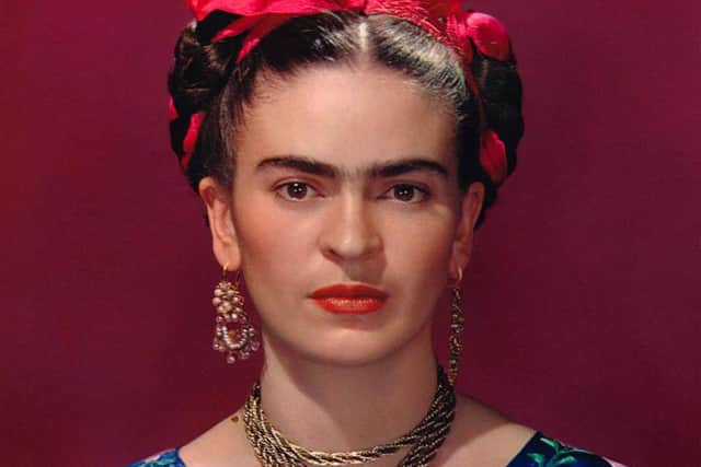 Frida Kahlo in blue satin blouse, 1939. Photograph Nickolas Muray  Nickolas Muray Photo Archives