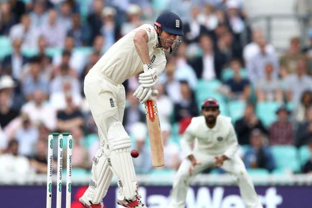 England's Alastair Cook defends a delivery at The Oval. Picture: John Walton/PA