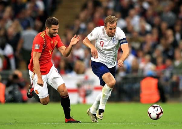 Spain's Nacho (left) and England's Harry Kane (right) battle for the ball. Picture: Adam Davy/PA