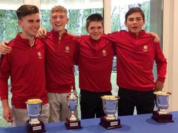 The England squad with their trophies, l-r, Conor Gough, Ben Schmidt, Max Hopkins and George Leigh.