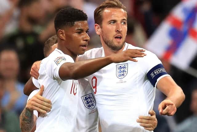 Marcus Rashford, left, celebrates with Harry Kane after giving England the lead against Spain (Picture: Adam Davy/PA Wire).