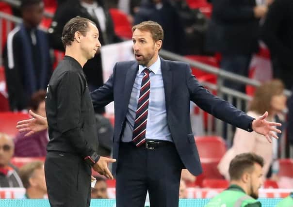 England manager Gareth Southgate pleads, without result, for Danny Welbecks late disallowed goal to stand.