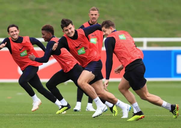 England's Harry Maguire, centre, laughs during a sprint exercise in England's training session at St Georges' Park, Burton (Picture: Mike Egerton/PA Wire).