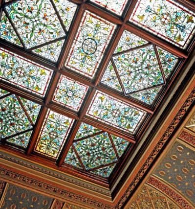 A stained glass and wood panelled ceiling