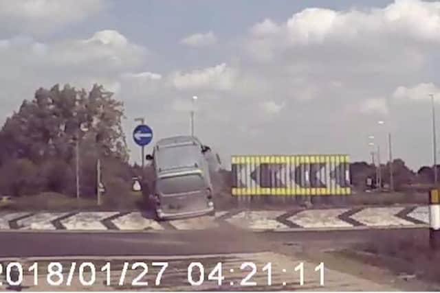 The van hurtles over the roundabout in the shocking footage. Photo: SWNS
