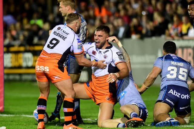 Castleford Tigers' Mike McMeeken celebrates his second-half try against Huddersfield Giants (Picture: Jonathan Gawthorpe).