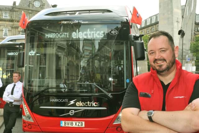 Alex Hornby with one of Harrogate's new electric buses.