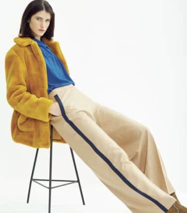 ATHLEISURE EDGE: Sports-inspired dressing moves away from the track and the gym and instead gets the luxe treatment, pairing the season's '70s spice-meets-neutrals hues and teaming faux fur and silks with fluid easy trousers, as with this look from Hobbs. Coat, Â£199; top, Â£139, trousers, Â£129; boots, Â£179.