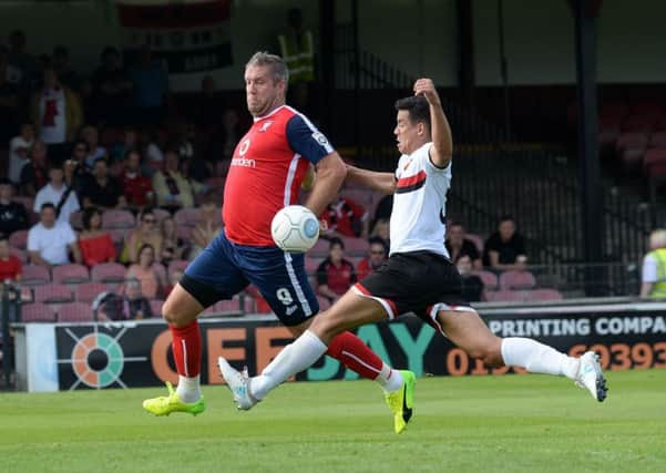 KEEP ON SMILING: Jon Parkin, in action for York City against FC United of Manchester last season. Picture: Bruce Rollinson
