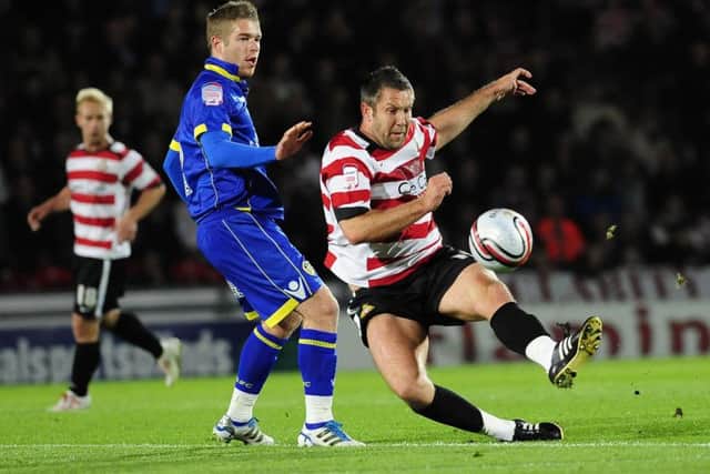 Jon Parkin battles for the ball for Doncaster Rovers against Leeds United's Adam Clayton in 2011. Picture: Anna Gowthorpe/PA