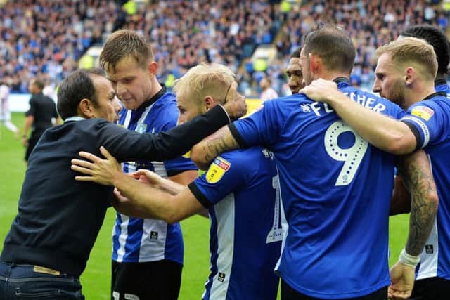 Sheffield Wednesday staff and players celebrate an equalising goal from Barry Bannan