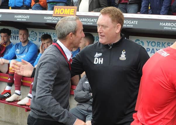 Friends reunited: David Hopkin acknowleges former Leeds United team-mate Lee Bowyer, now manager of Charlton. Picture: Tony Johnson