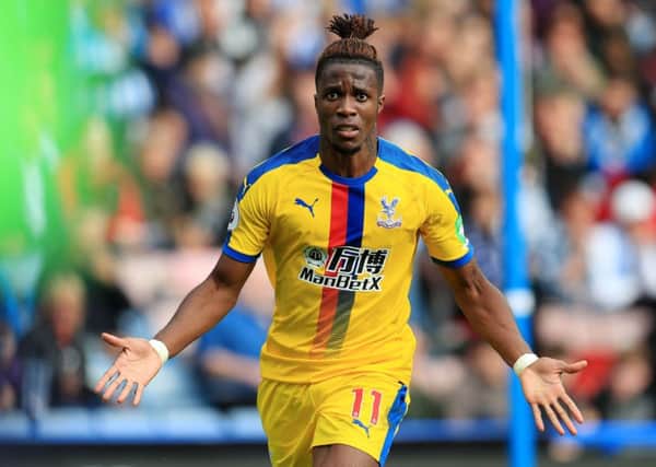 Crystal Palace's Wilfried Zaha celebrates scoring his side's first goal (Pictures: PA)