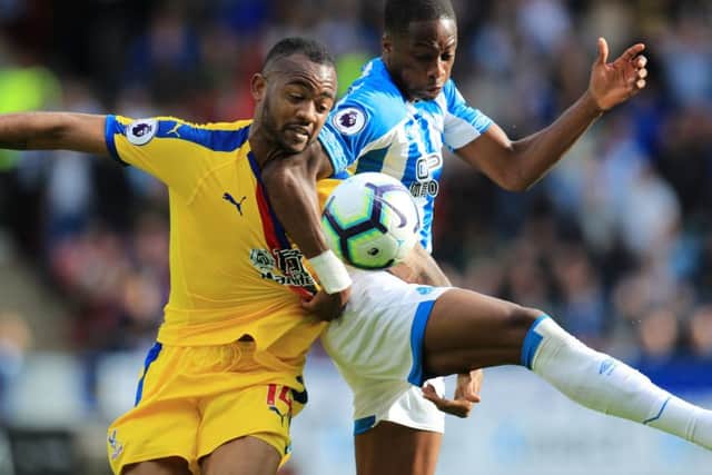 Arm wrestle: Huddersfield Towns Terence Kongolo gets to grips with Crystal Palaces Jordan Ayew