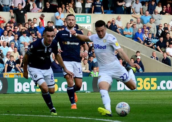 Point salvaged: Jack Harrison fires home the late equaliser for Leeds.