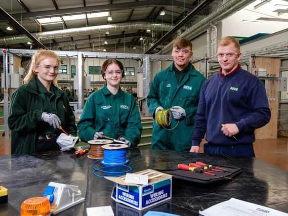 Apprentices (from left) Amy Conroy, Tegan Finnerty and Liam Murrey with electrical instructor Lee Sutton.