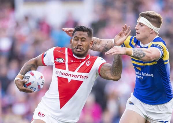St Helens' Ben Barba is tackled by Leeds's Liam Sutcliffe.